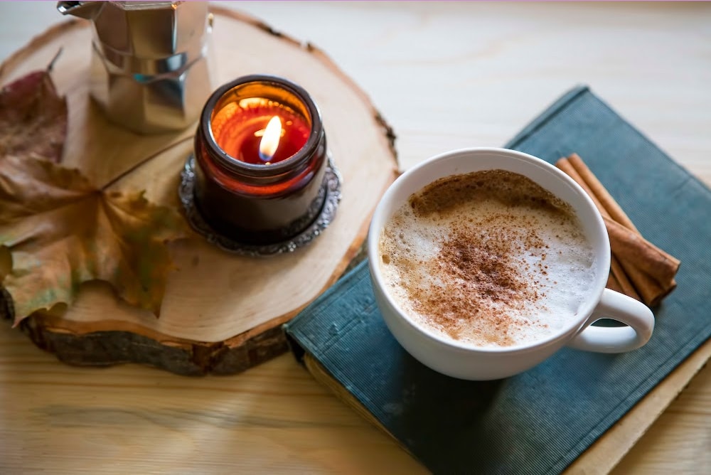 fall equinox aesthetic coffee candle book